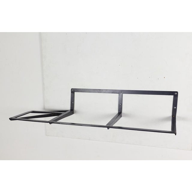 Wall Console attributed to Osvaldo Borsani, 1960s, in Very Good conditions. Designed 1960 to 1969 This piece is attributed...