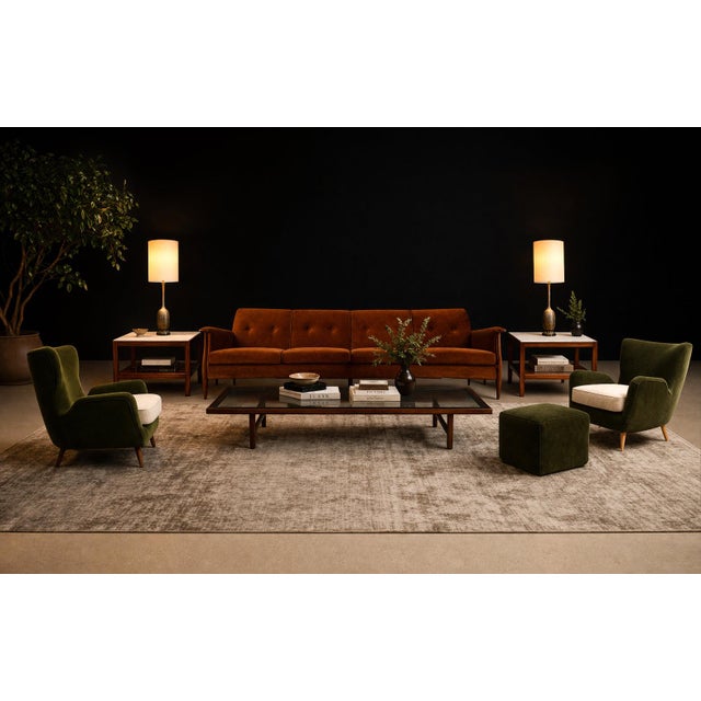 A striking and highly characteristic seating group by Carlo Hauner, this pair of armchairs with matching pouf captures the...