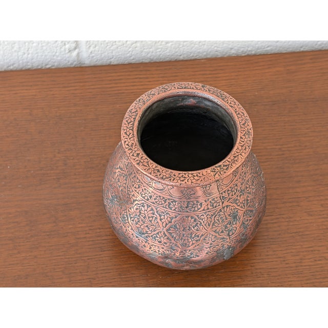 A magnificent example of historic Islamic metalwork, this authentic 19th-century Middle Eastern tinned copper water pot...