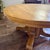 Newly refinished vintage or antique quarter-sawn oak round pedestal dining table, featuring an Empire Revival style that...