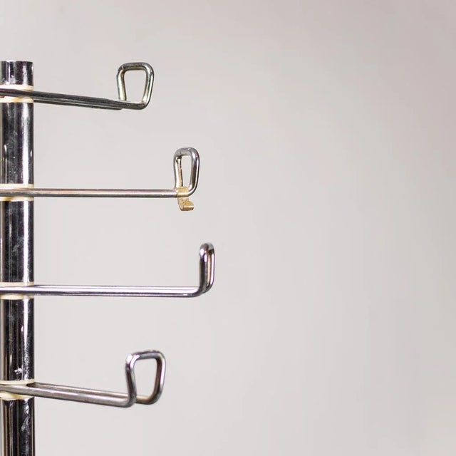 1970s design coat rack. Metal structure. 4 arm formed with variable length. Marble base. Good condition, with some signs...