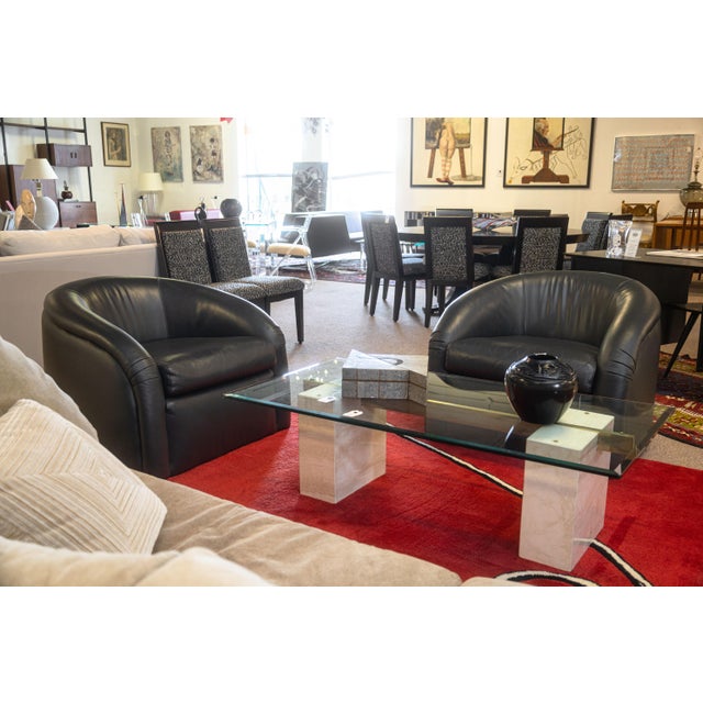 A pair of custom Classic Gallery club chairs. Each of these wonderful postmodern club chairs sport a smooth black leather...