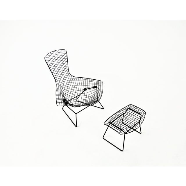 Black metal armchair and ottoman by harry bertoia. Model: bird. Ottoman dimensions: h: 59 cm l: 39 cm d: 42 cm. Wear due...