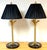 A striking pair of Italian Neoclassical-style gilt metal table lamps formed as three intertwined serpents, rising in a...