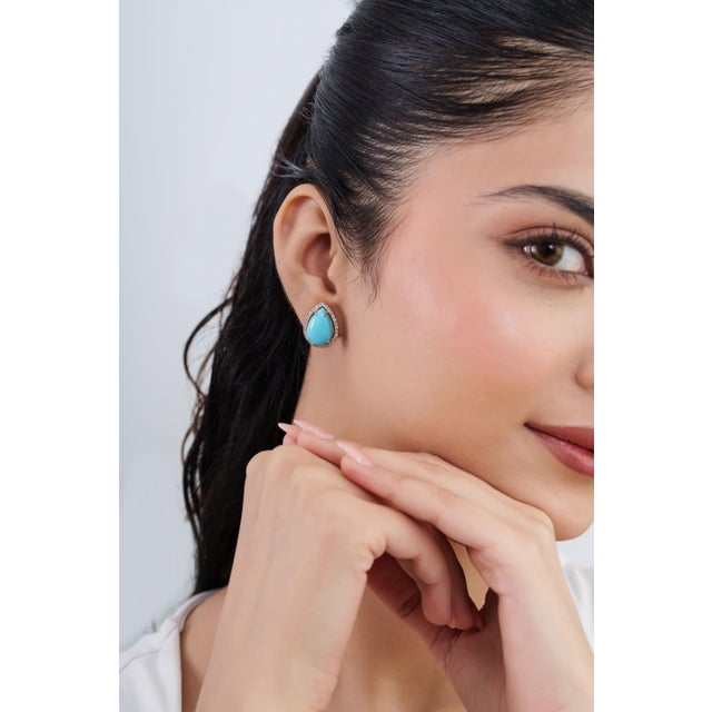 Add a touch of refined color to your fine jewelry collection with these elegant Sleeping Beauty Turquoise earrings,...