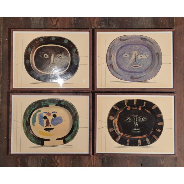 An exquisite collection of four framed shiny polychrome prints of Picasso Vallauris ceramic plates depicting faces in...