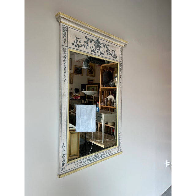 A gorgeous Vintage French Neoclassical or Louis XVI style wall mirror by John Widdicomb. The mirror retains the Widdicomb...