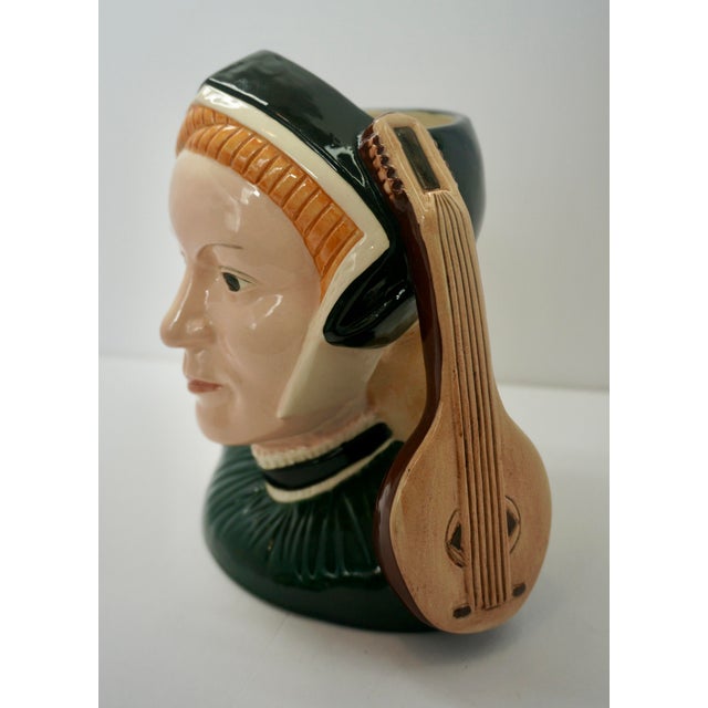 Add a touch of British royal history to your collection with this striking Royal Doulton Character Jug featuring Jane...