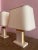 Two antique lamps designed by contemporary designer Camille Breesch. Crafted from travertine blocks, brass detailing and...