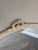 Elegant vintage oval wall mirror featuring a beautifully carved French Provincial inspired frame with delicate ribbon...