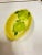 Bright Yellow oval dish. Marked made in Italy on the bottom. 2 Green circular object painted on the bottom of the dish. I...