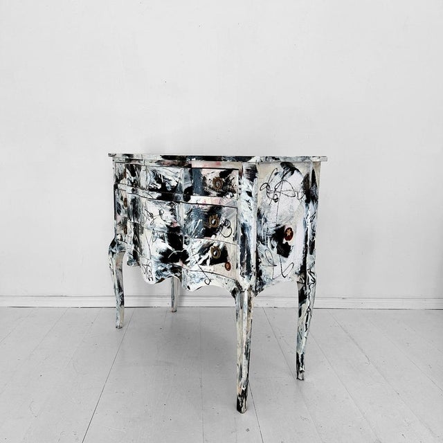 The Abstract Painted Baroque Style Commode in Black and White by Felix Bachmann (2024) is a striking fusion of classical...