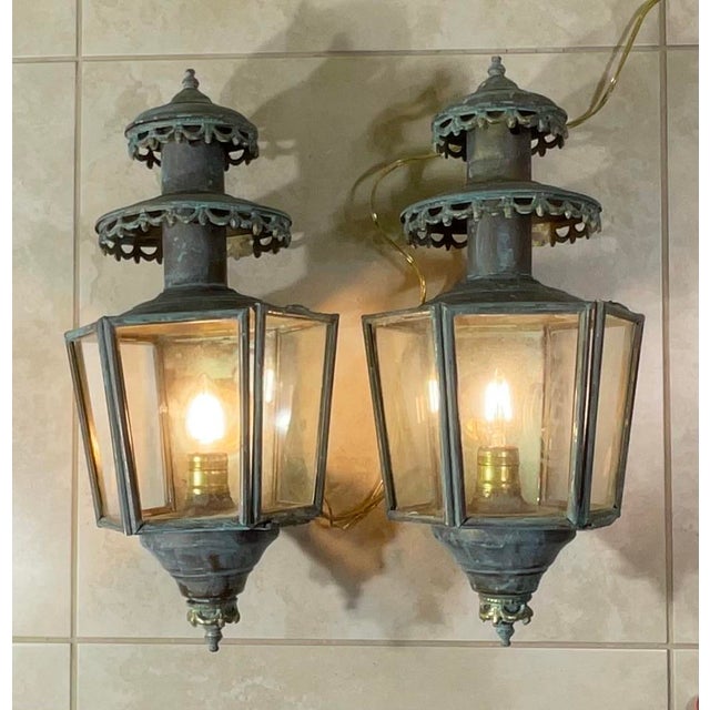 For sale is a magnificent and rare matching pair of antique or vintage solid brass exterior wall lanterns (also known as...