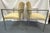 A nice pair of Hickory Business Furniture armchairs from the late 20th century. They have a heavy metal frame in a silver-...