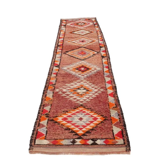 Handknotted vintage decorative Herki runner from Northern Iraq. Approximately 50-60 years old. In very good condition.