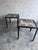 These striking side tables combine industrial iron frames with colourful reclaimed wood tops, creating a unique patchwork...