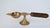 Vintage brass oil lamp or diya with a wooden handle, also known as an aarti lamp. It is a traditional item used in Hindu...