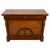 Decorative Empire-style chest of drawers featuring a bold Neoclassical design with opposing griffins flanking a torch...