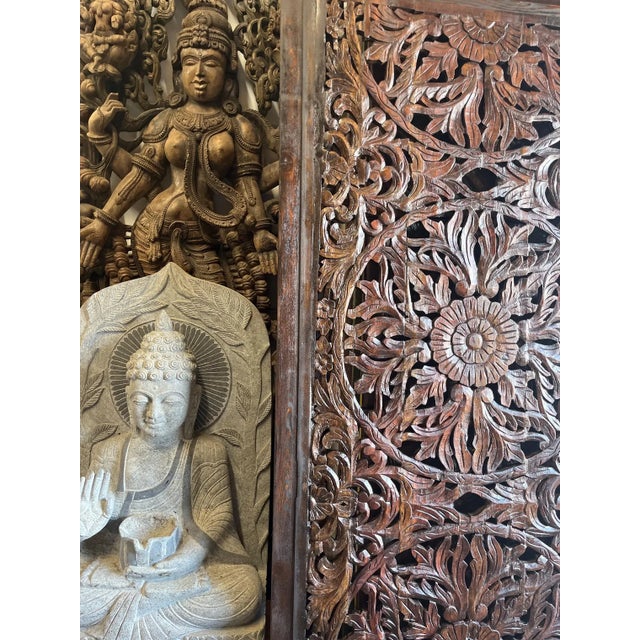 Add timeless character and architectural interest to your space with this vintage carved wood barn door featuring an...
