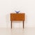 Small Danish vintage teak dresser from the 1960s. It features three drawers with beautifully curved solid teak handles,...