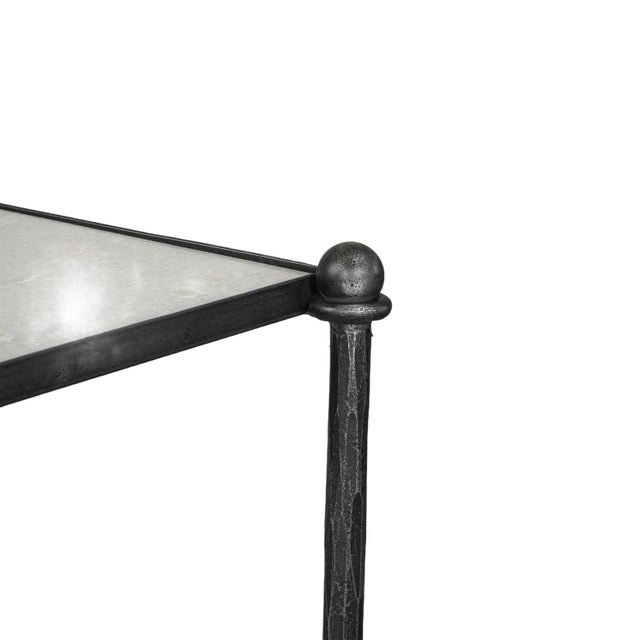 The Gio console, featuring iron and inset alabaster marble. It's a durable and elegant addition.