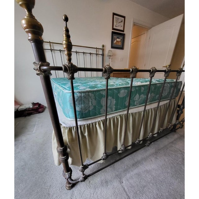 Beautiful antique cast iron and brass bed frame from the late 1800’s era (patent stamp included at the side rails). Fits a...