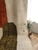 A bold contemporary color-block Moroccan rug — clean fields of rust-orange and olive-green float across a plush cream...