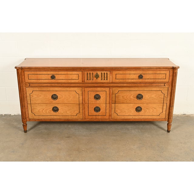 A gorgeous French Regency Louis XVI or Neoclassical style nine-drawer dresser or credenza By Baker Furniture USA, Circa...