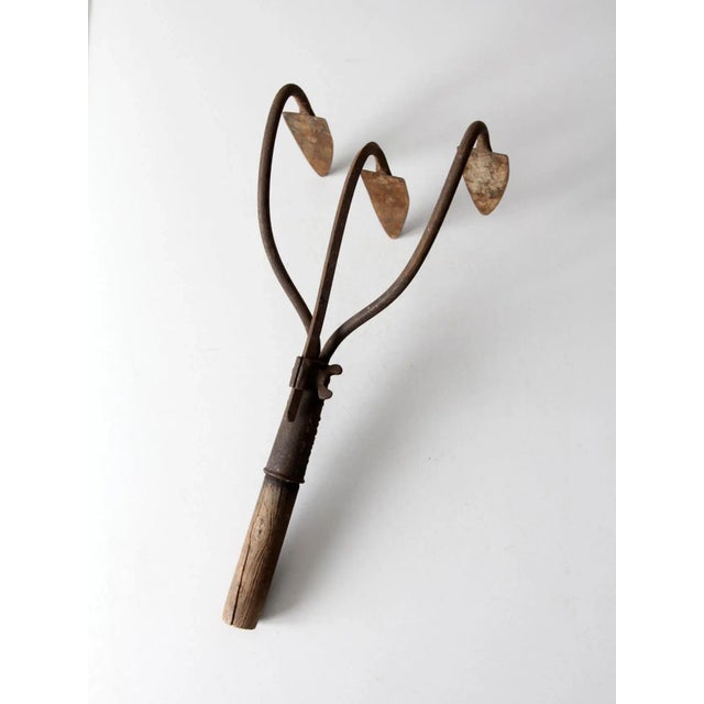 This antique garden cultivating claw dates to the early 1900s and was produced by the J.L. Rich Company of Rock Falls,...