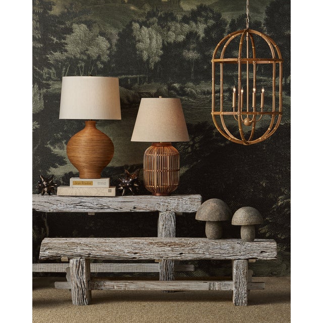 The Susel Table Lamp is handmade through a painstaking process whereby artisans take strips of rattan without the skin and...