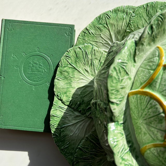 A spectacular and monumental Italian majolica trompe l’oeil cabbage tureen crowned with a vibrant citrus finial, executed...