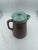 Unique brown and aqua pitcher. The stoneware pottery is in good condition and has lovely color combination. Good condition...