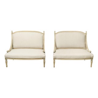 Pair of French 1900s Louis XVI Style Walnut Settees with Scrolling Arm Supports For Sale
