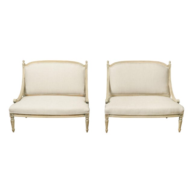 Pair of French 1900s Louis XVI Style Walnut Settees with Scrolling Arm Supports For Sale