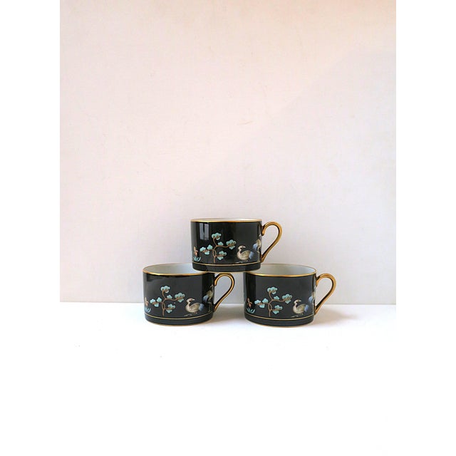 A beautiful set of three (3) porcelain coffee or teacups, in the Chinoiserie design style, circa late-20th century....