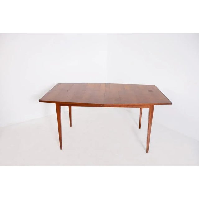 American-made geometric dining table from 1950. The table is made entirely of wood and presents interesting clean...