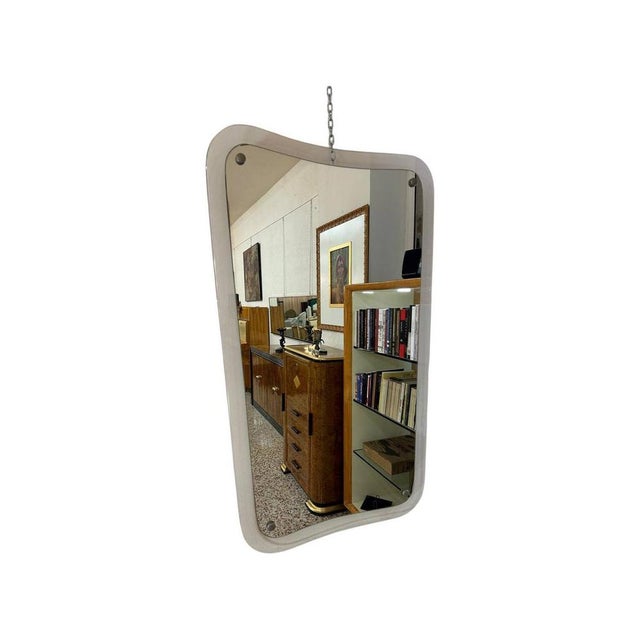 This Art Deco set features a mirror and its matching wall hanging console. They were both produced in Italy in the 1940s...
