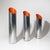 Three chromed metal umbrella stands from the 1970s, characterised by an essential cylindrical shape ending with a...