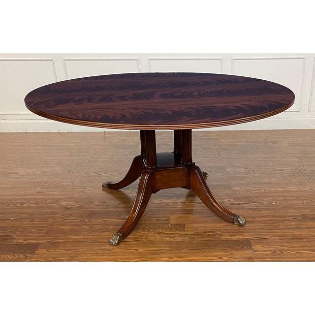 This is a 60” round traditional mahogany dining table by Leighton Hall made in the Suwanee, Georgia shop. It features a...