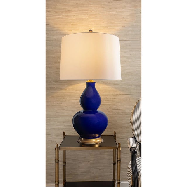 Rockford is our designer classic double gourd shaped lamp. Featuring a rich dark navy glaze porcelain, the lamp is...