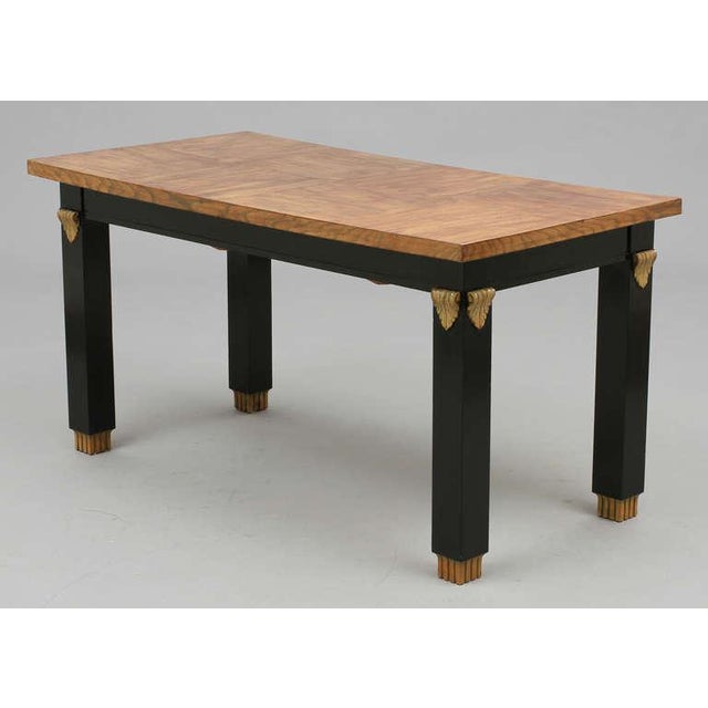 The library table attributed to Otto Schulz, Sweden, circa 1940. Lacquered and painted wood. Measures: L 60" x 29.5" x...