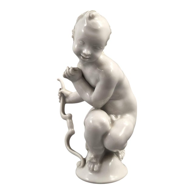 A finely modelled Meissen Blanc de Chine porcelain figure of Amor with a bow, after a model by Paul Scheurich (1883–1945),...