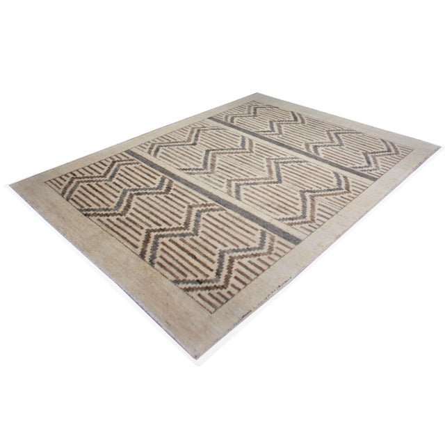 A beautiful handmade Navajo style rug. Geometric design woven in by Aara Rug hands. This rug is made of 75% bamboo silk...