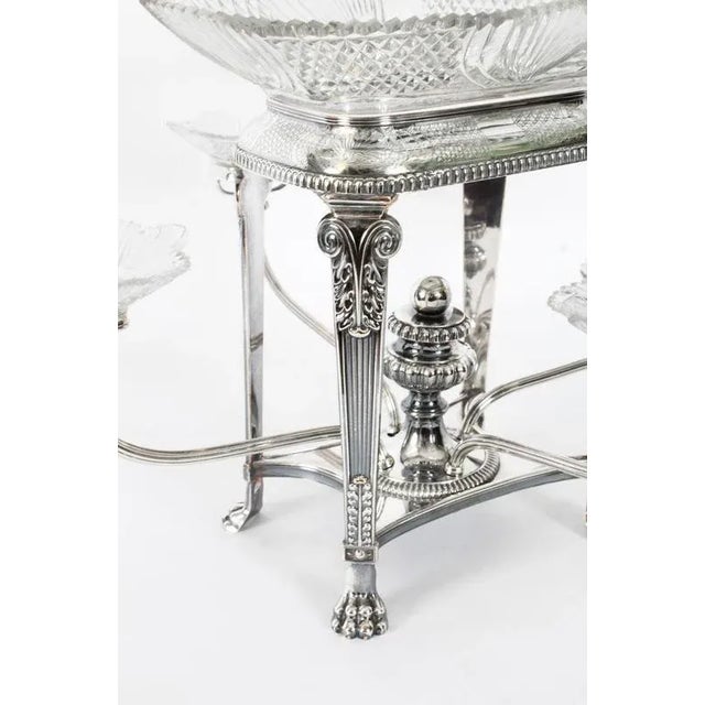 This is an elegant antique Old Sheffield plate and cut glass centrepiece with four sweeping branches, circa 1820 in date....