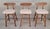 A set of 3 Mid-Century Modern counter top stools. Classic modern design with oval seat backrest. Made of solid walnut....