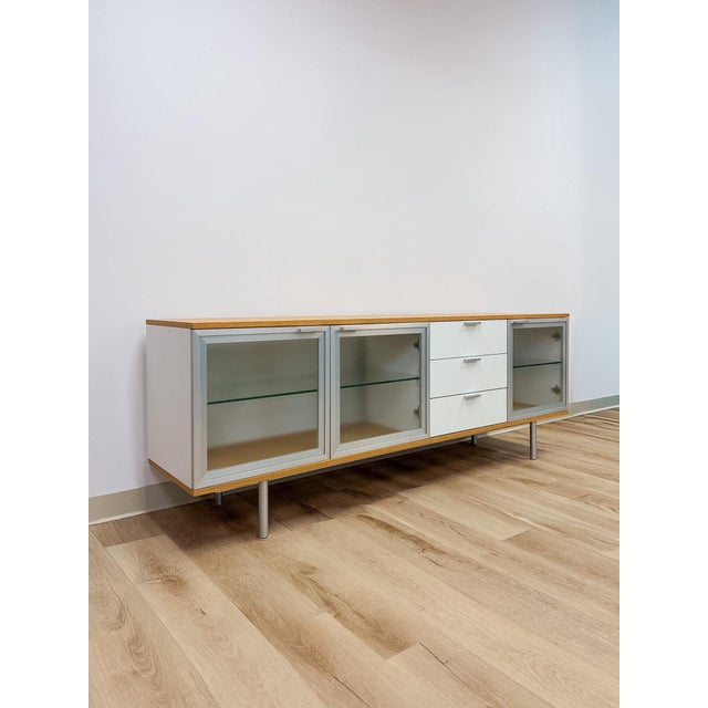 This striking modern MCM sideboard and buffet is a beautifully composed and versatile dining room or living room storage...