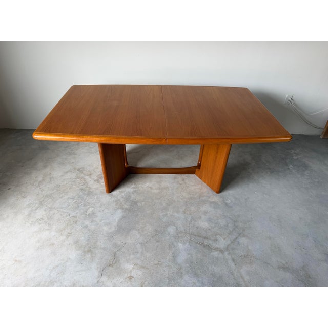 Beautiful vintage Danish Mid-Century Modern expandable dining table by Ansager Møbler, crafted in Denmark. Featuring a...