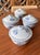 Four beautiful blue and white, individual, lidded rice bowls decorated with cranes and a pansy lid button.