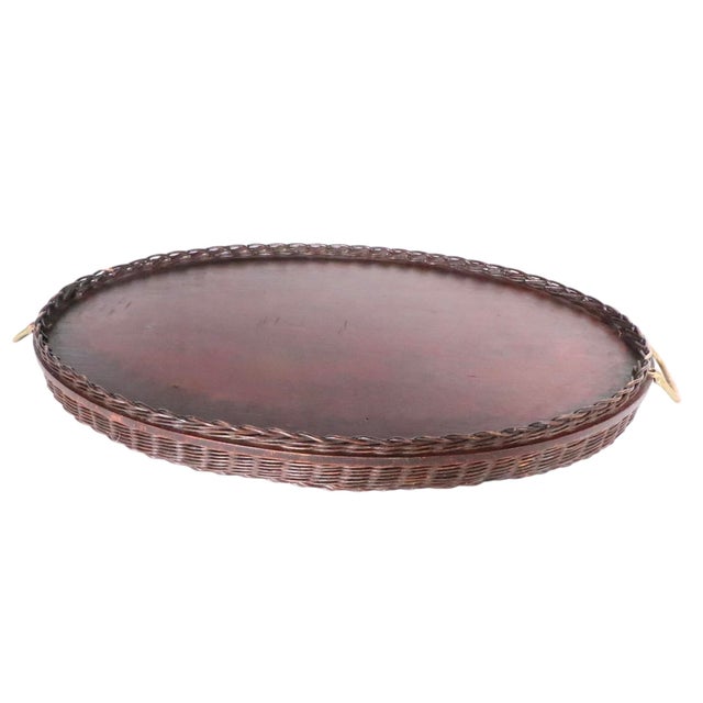 Antique wicker, brass and glass serving tray with decorative foliate print surface under glass. This charming piece is in...