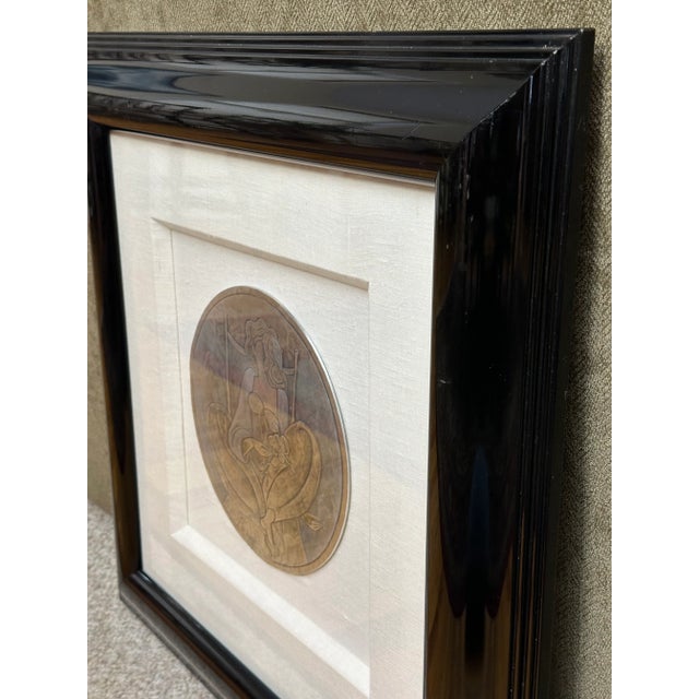 Add an elegant touch to your art collection with this striking hand-hammered aluminum relief titled Cendrillon by renowned...